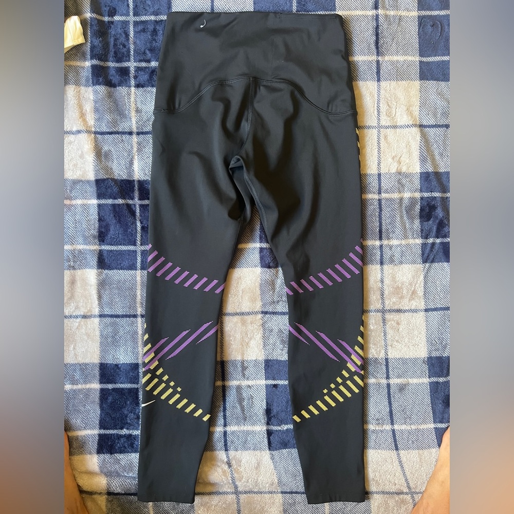 Nike Black Leggings with Purple and Yellow Diagonal Stripe Accents - Picture 7 of 10
